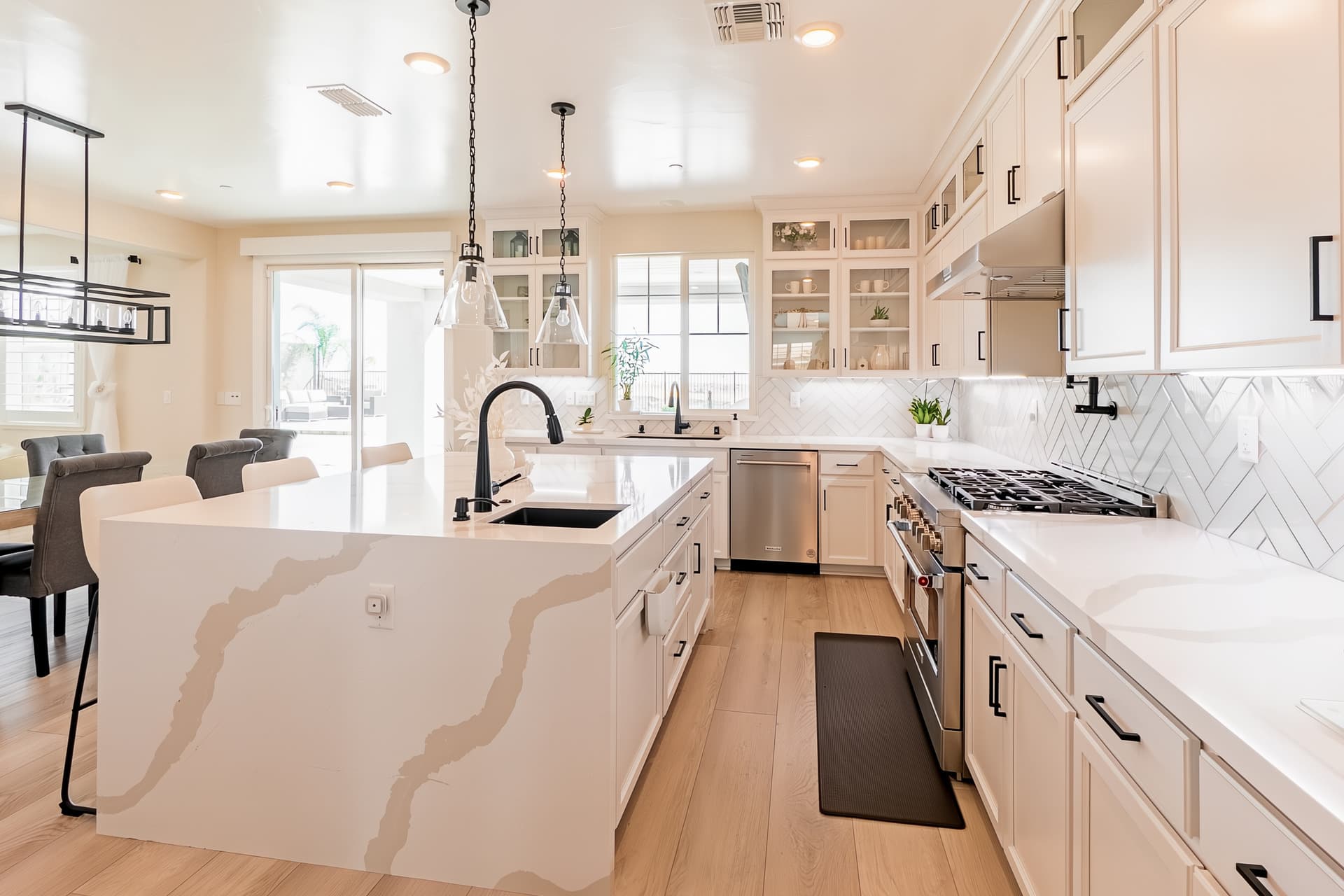 Modern kitchen with large marble island and essential appliances